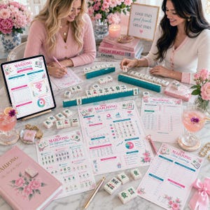 May include: A tabletop scene featuring a Mahjong game set with teal racks and white tiles. Pink floral-themed game statistics charts, a tablet, and a book are also present. The scene is decorated with pink flowers and cocktails.