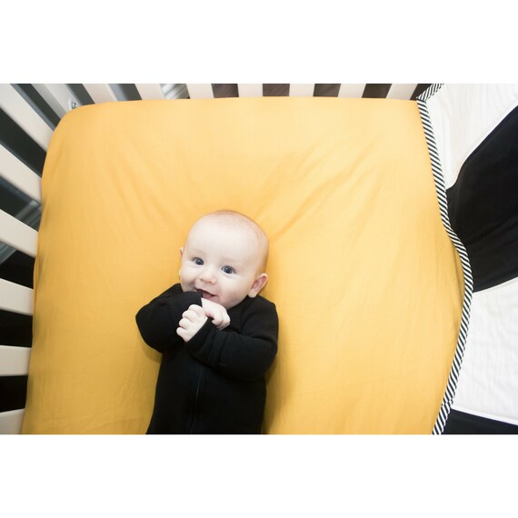 mustard yellow crib sheet