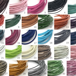 May include: Thirty-one spools of leather cord in various colors, including brown, pink, red, black, green, blue, white, and gray. Each spool is labeled with a number from 1 to 31.