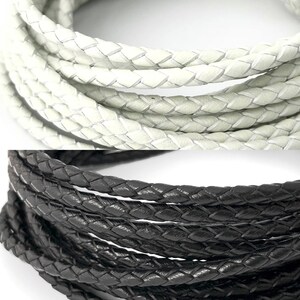 Puede incluir: Dos carretes de cord&oacute;n de cuero trenzado. El carrete superior es blanco y el carrete inferior es negro.