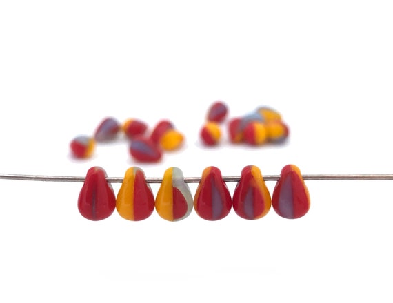 Perle di vetro Helios® di Puca® 6x10 mm - Costellazione trasparente arancione x10g - Perles & Co