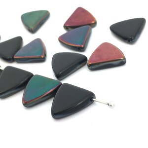 May include: Assortment of iridescent triangle shaped glass beads in black, green, and red. The beads are strung on a silver wire.