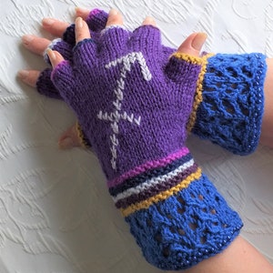 May include: Purple fingerless gloves with a white embroidered design and a blue crocheted cuff. The cuff has a row of blue beads around the edge.