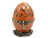 Orange Limoges handpaint French music egg. Bird collection. Craftsmanship. music box. Hand-painted porcelain chardonneret.