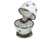 French Bulldog music egg. Limoges porcelain hand-paint . Paws dog paint. french bulldog dog breed. crown glasp.