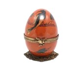 Porcelain Limoges music box. Orange bird collection. Limoges porcelain egg music box. music Romeo and Juliet.