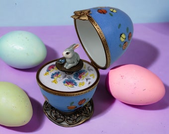 A mischievous rabbit and his friend the butterfly sing happily with ladybugs, hand-painted Limoges egg, customizable Artisanal gift.