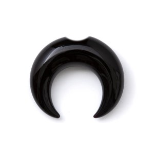 May include: Black crescent moon shaped ear gauge made of polished horn.