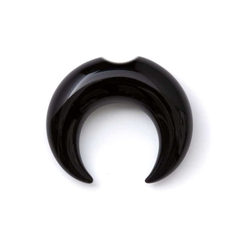 May include: Black crescent moon shaped ear gauge made of polished horn.
