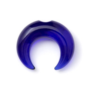 May include: A blue glass crescent moon shaped ear gauge.