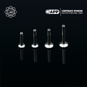 May include: Four silver barbell studs of different lengths, displayed on a black background. The studs are commonly used for ear piercings.