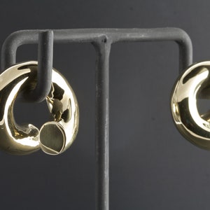 Peoples-sieraden – spoelgewichten – wit of geel messing – geprijsd per paar.