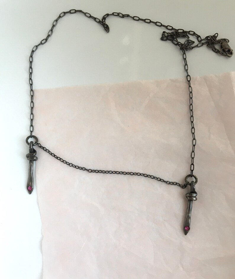 symmetrical necklace double dagger pendant rubies blackened silver camille hempel design two daggers