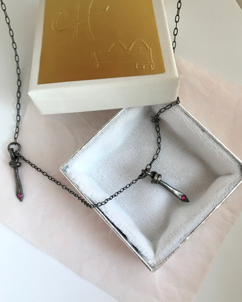 symmetrical necklace double dagger pendant rubies blackened silver camille hempel design two daggers