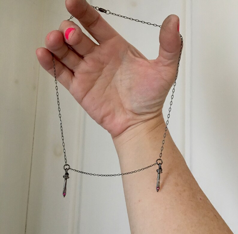 symmetrical necklace double dagger pendant rubies blackened silver camille hempel design two daggers