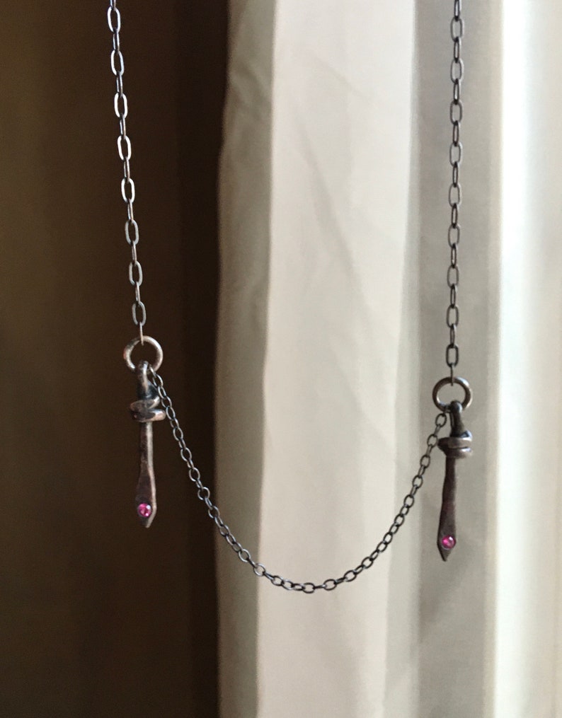 symmetrical necklace double dagger pendant rubies blackened silver camille hempel design two daggers
