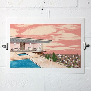 May include: A mid-century modern house with a swimming pool and a pink sky in the background. The house has large windows and a patio with chairs and tables. The pool is surrounded by a concrete deck.