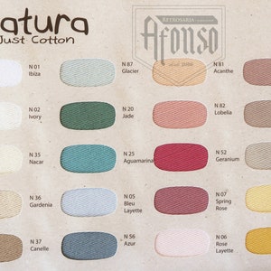 May include: A color chart of 16 cotton embroidery floss colors from Natura Just Cotton by Retrosaria Afonso. The colors include white, ivory, green, blue, red, pink, yellow, and brown.