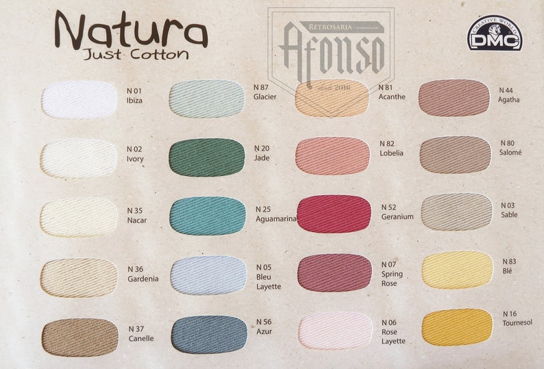 May include: A color chart of 16 cotton embroidery floss colors from Natura Just Cotton by Retrosaria Afonso. The colors include white, ivory, green, blue, red, pink, yellow, and brown.