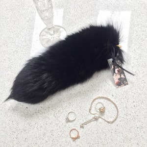 Jet black fox fur tail keyring.