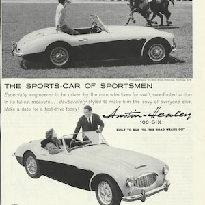 May include: A black and white photo of a white and black Austin-Healey 100-Six sports car. The car is parked on a grassy field with a person standing next to it. The text "Austin-Healey 100-Six" and "Built to run 'til the road wears out" is printed on the image.