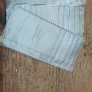 Paquete de 3 billeteras de vinilo resistente de 6 páginas para chequera con insertos para tarjetas de crédito y fotografías.