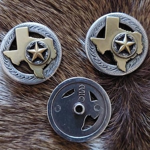 May include: Two silver and gold Texas-shaped buttons with a star in the centre, and a silver metal button with a Texas-shaped cutout.