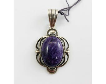 May include: A silver pendant with a purple and white chalcedony stone set in a decorative frame.