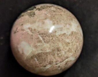 Fluorescent 2.6-inch diameter Rhodonite Sphere