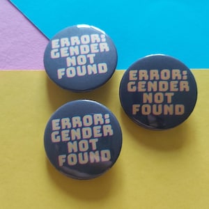 May include: A set of three ceramic mugs with a speckled, matte finish. Each mug features a different color: light blue, cream, and gray. The mugs have a simple, modern design and a comfortable handle.