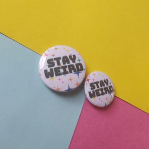 Stay Weird White and Rainbow Star 25mm / 32mm Button Badge Pin Trippy Radiating Rainbow Illustration Background quirky novelty fun gift