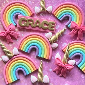 Fondant rainbow, bow, unicorn ears and horn. Suits number cake xx