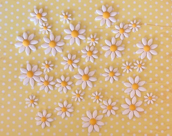 30 white fondant dasies with yellow centre. Cake toppers. Cake decorations. Suits bee theme