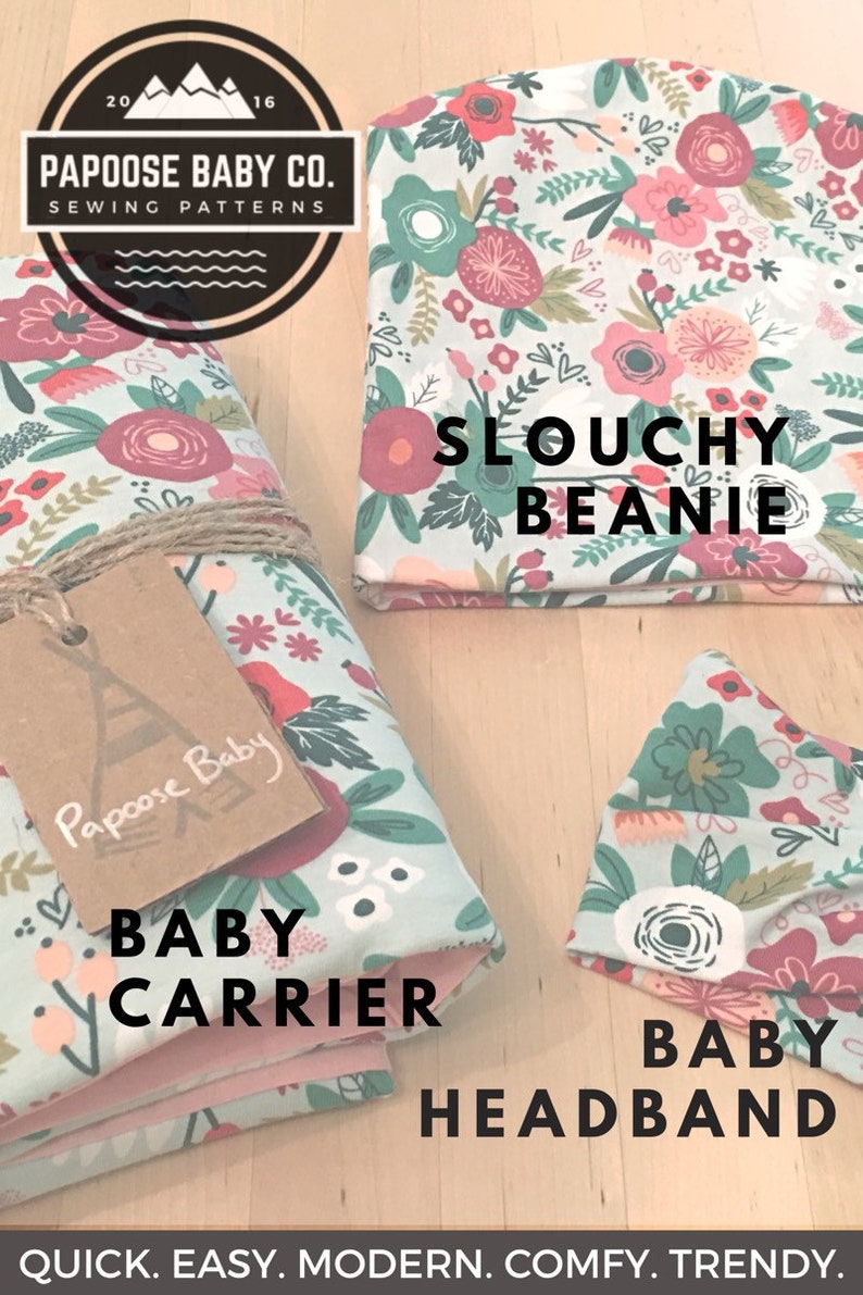 May include: A set of three sewing patterns for a baby carrier, a slouchy beanie, and a headband. The patterns feature a floral print with pink, red, and green flowers on a light blue background. The text "Papoose Baby Co. Sewing Patterns" is on a brown circle with white text. The text "Slocuhy Beanie", "Baby Carrier", and "Baby Headband" are in black text.