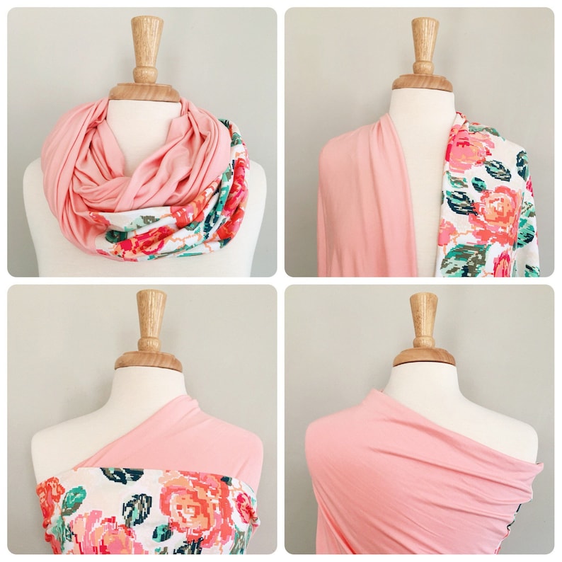 May include: A pink infinity scarf with a floral print. The scarf can be worn as a neck scarf or a headband.
