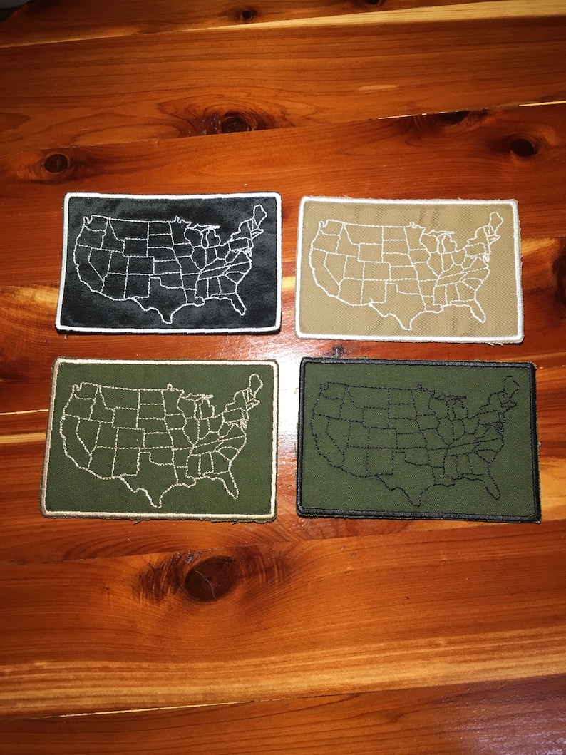 May include: Four embroidered patches of the United States map. The patches are in black, tan, green, and dark green. The state lines are white on the black and tan patches, and black on the green patches.