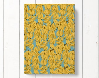 May include: A blue background with a repeating pattern of yellow bananas. The bananas are arranged in bunches and are facing different directions.