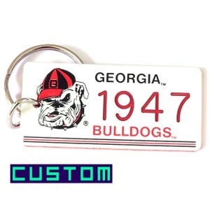 Personalisierte Bulldoggen Schlüsselbund mit individueller Gravur - Fan Souvenir - CollegeStudent Geschenk - Lizenzierter ECAA Schlüsselring