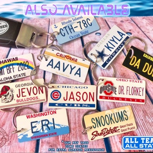 May include: A collection of rectangular metal keychains designed as miniature license plates from various U.S. states, featuring diverse names, team logos, and state slogans. Each keychain includes a metal split ring for attachment.