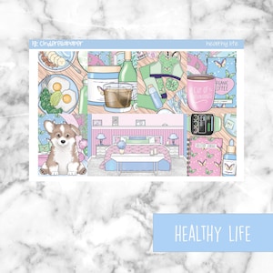 May include: A digital planner sticker sheet with a pink and blue color scheme. The sheet features illustrations of a dog, a bedroom, a cup of coffee, a fitness tracker, and a journal. The text "healthy life" is printed on the sheet.
