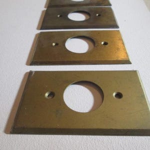 One Older Vintage Brass Electrical Round Hole Outlet Plate Cover Semi Antique Shabby Sharp Corner Made In USA 9513