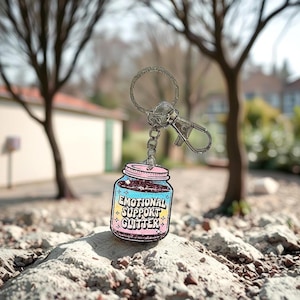 Porte-clés bouteille rose pailleté : accessoire léger et durable