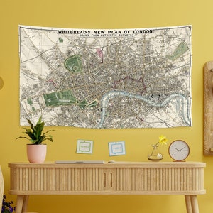 May include: A rectangular wall tapestry featuring a vintage map titled Whitbread's New Plan of London, Drawn from Authentic Surveys. The map displays detailed street layouts, the River Thames in light blue, and green park areas on a cream background.