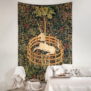 May include: A tapestry featuring a white unicorn trapped in a circular wooden fence. The unicorn is surrounded by a lush green forest with colorful flowers and leaves. The tapestry is a reproduction of the famous Unicorn tapestries.