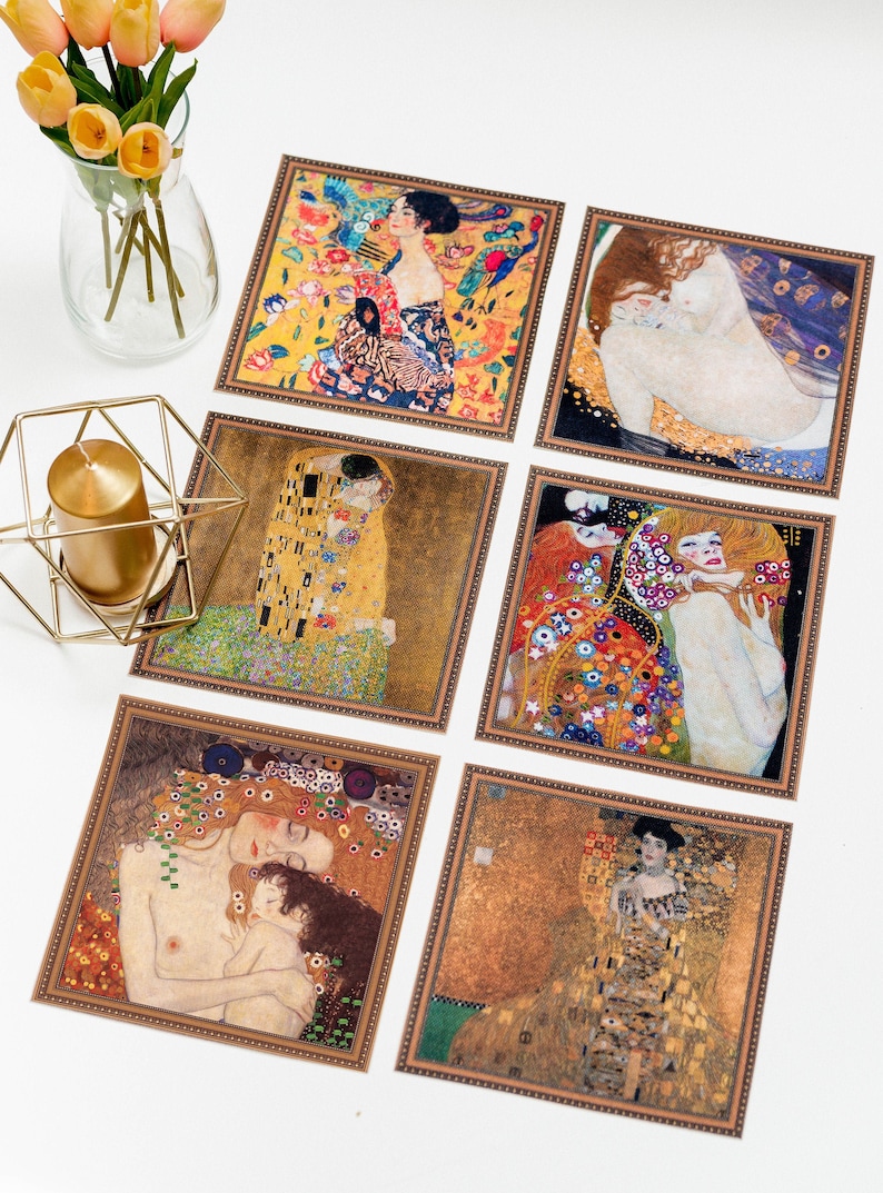 May include: Six framed prints of famous paintings by Gustav Klimt. The prints feature a variety of subjects, including portraits, landscapes, and abstract designs. The frames are all gold-colored and have a decorative border.