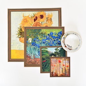 May include: Four framed art prints featuring different floral still life paintings. The top print shows a yellow sunflower bouquet, the second print shows blue irises, the third print shows a green and red tropical plant, and the bottom print shows a red poppy bouquet.