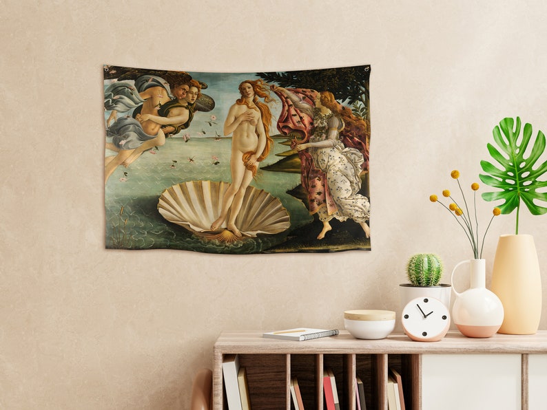 May include: A tapestry depicting the Birth of Venus, a famous Renaissance painting by Sandro Botticelli. The tapestry features a nude woman standing on a giant scallop shell, with two figures in the background.