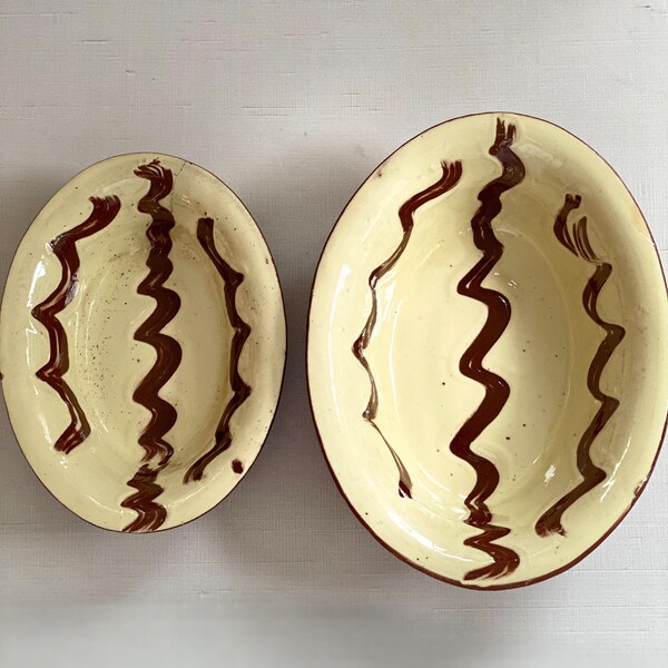 Vintage Redware Terracotta Clay Pottery Oval Bowls Bakeware with cream glaze / red brown swirls (set of two)