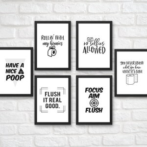May include: Six black framed prints with white backgrounds and black text. The prints feature humorous bathroom-themed sayings, including "Have a Nice Poop", "Rollin' with my homies", "No Selfies Allowed", "You Never Know What You Have Until It's Gone", "Flush It Real Good", and "Focus Aim Flush".