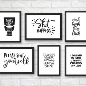 May include: Six black framed prints with white backgrounds and black text. The prints feature humorous bathroom-themed sayings, including "Shit's About To Go Down", "Shit Happens", "Wash Brush Floss Flush", "Please Seat Yourself", "It's All Shits & Giggles Until Someone Giggles & Shits", and "I Laughed So Hard Tears Ran Down My Legs".